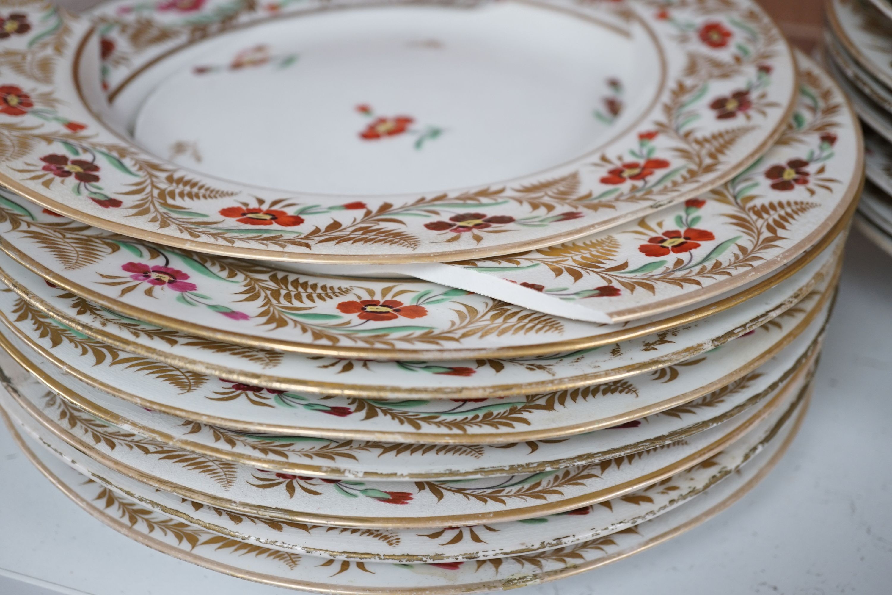 An early 19th century Derby seventeen-piece part dinner set, lobed oval serving dishes 31cm.